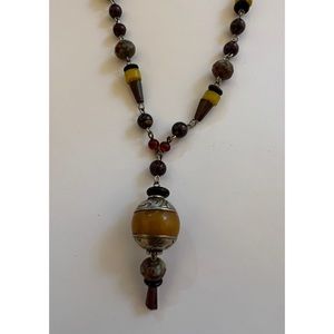 Bead necklace with silver toggle.